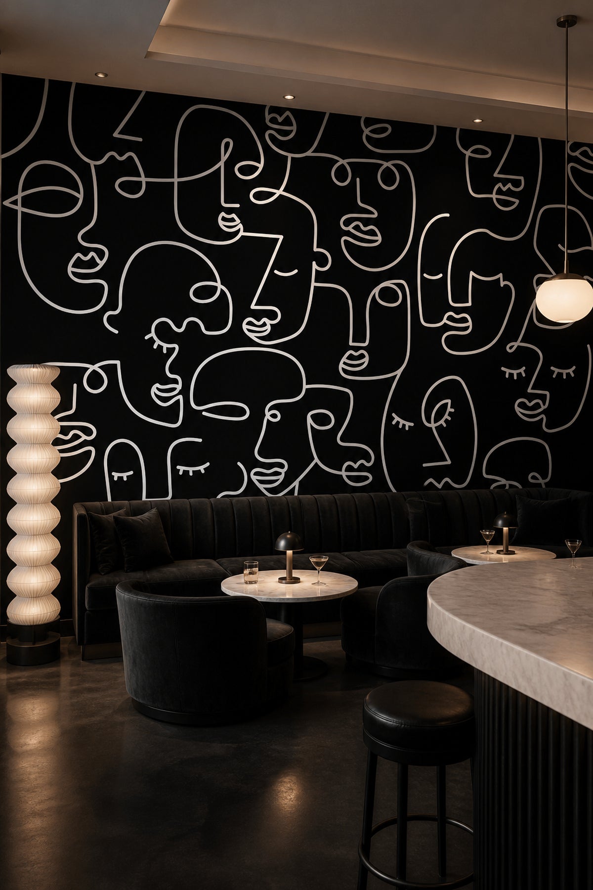 Black Abstract Line Faces wall mural behind a bar seating area