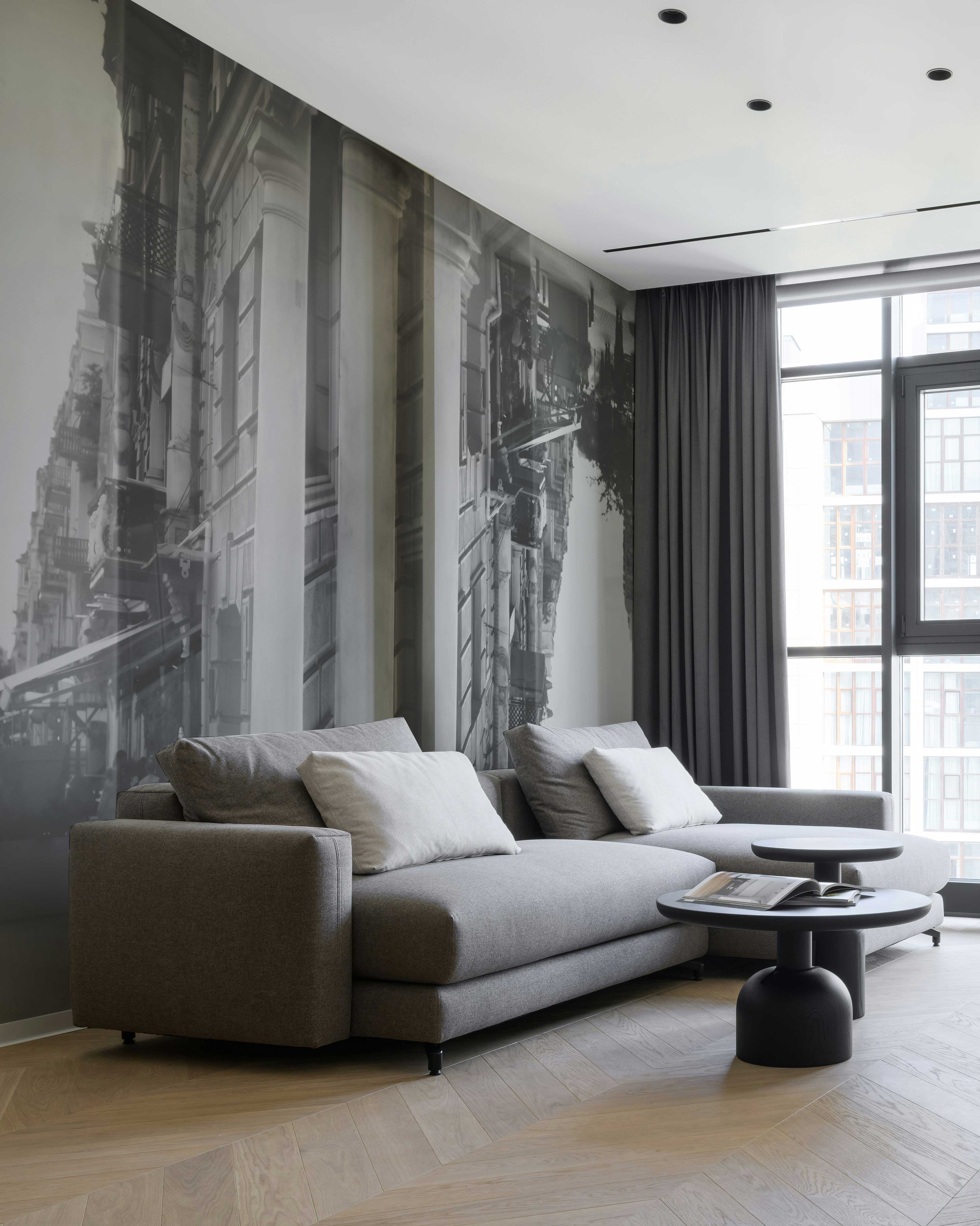 Parallaxis Wall Mural in a modern living room with a gray sectional sofa.