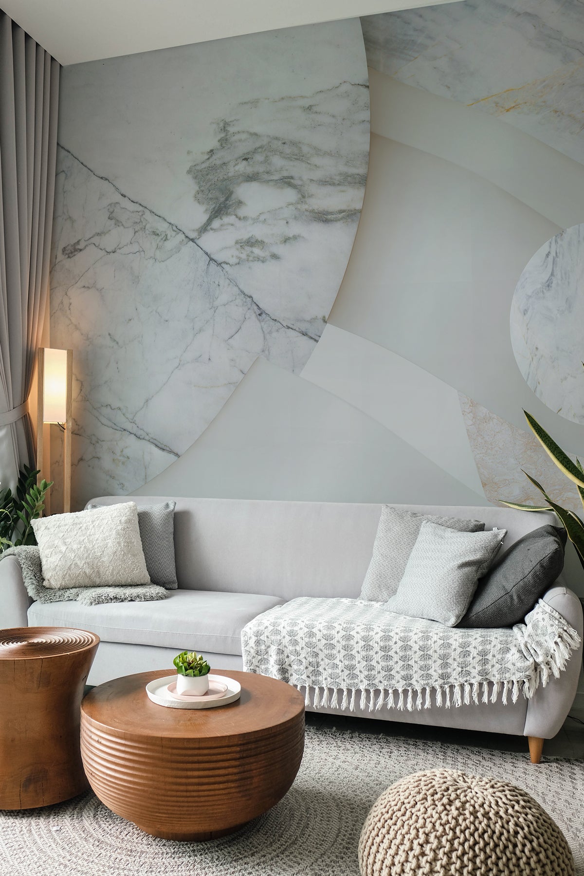 Astra Veil / Marble showcased in a living room with a gray sofa and wooden coffee table.
