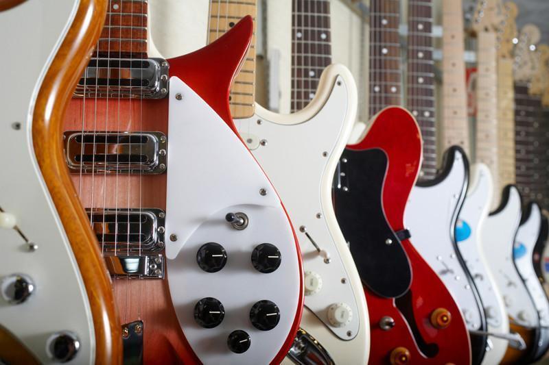 Electric guitars hanging on wall Wall Mural-Wall Mural-Eazywallz