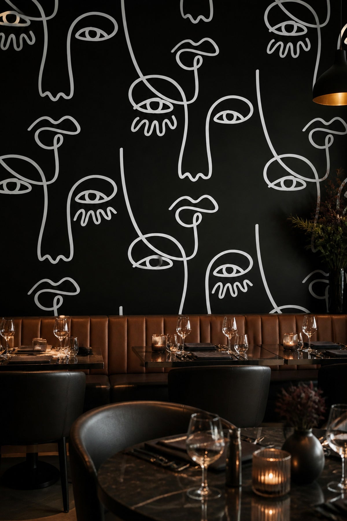 Large Black Abstract Line Faces wall mural in a dining room