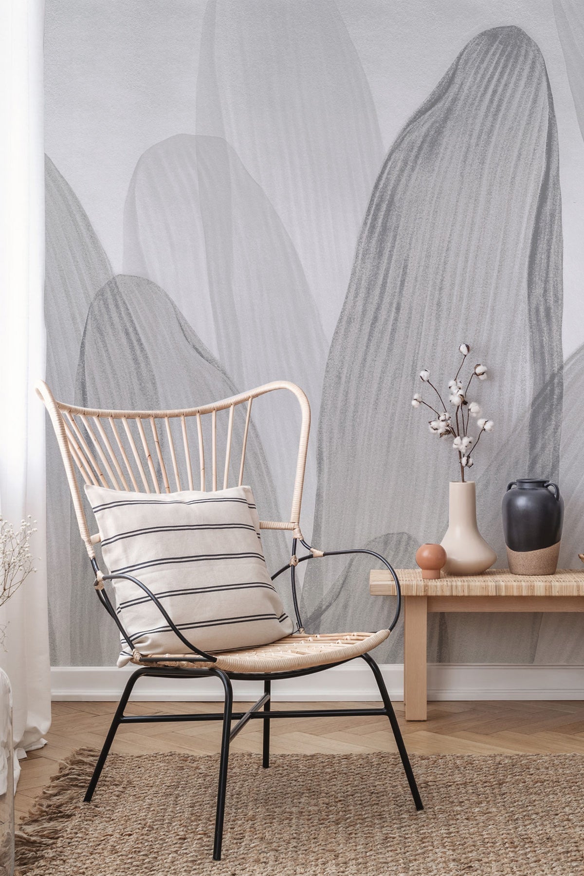 Elowen / Graphite wall mural wall mural in a room with a woven chair with a striped cushion.