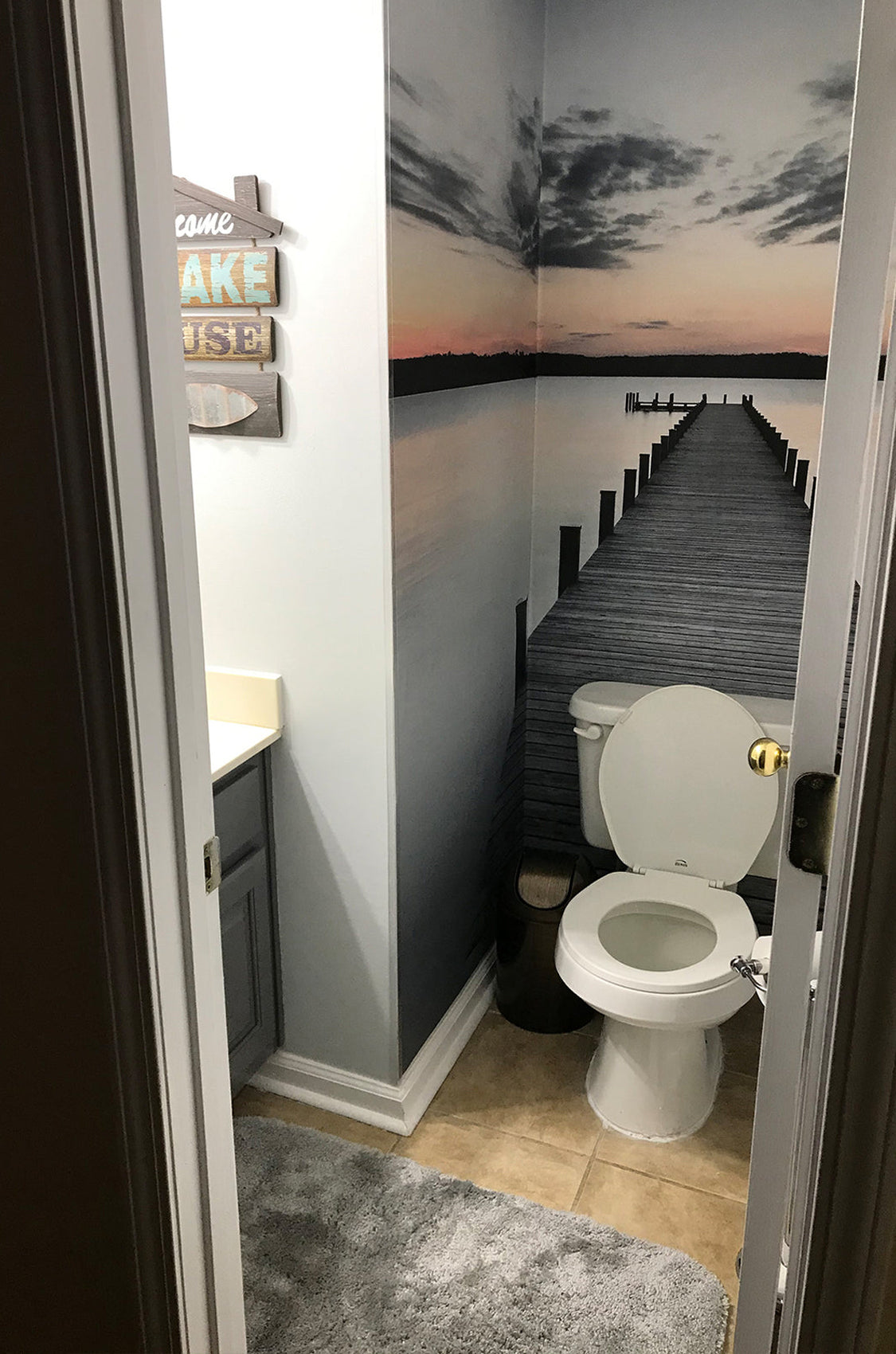 sunset pier wall mural in powder room