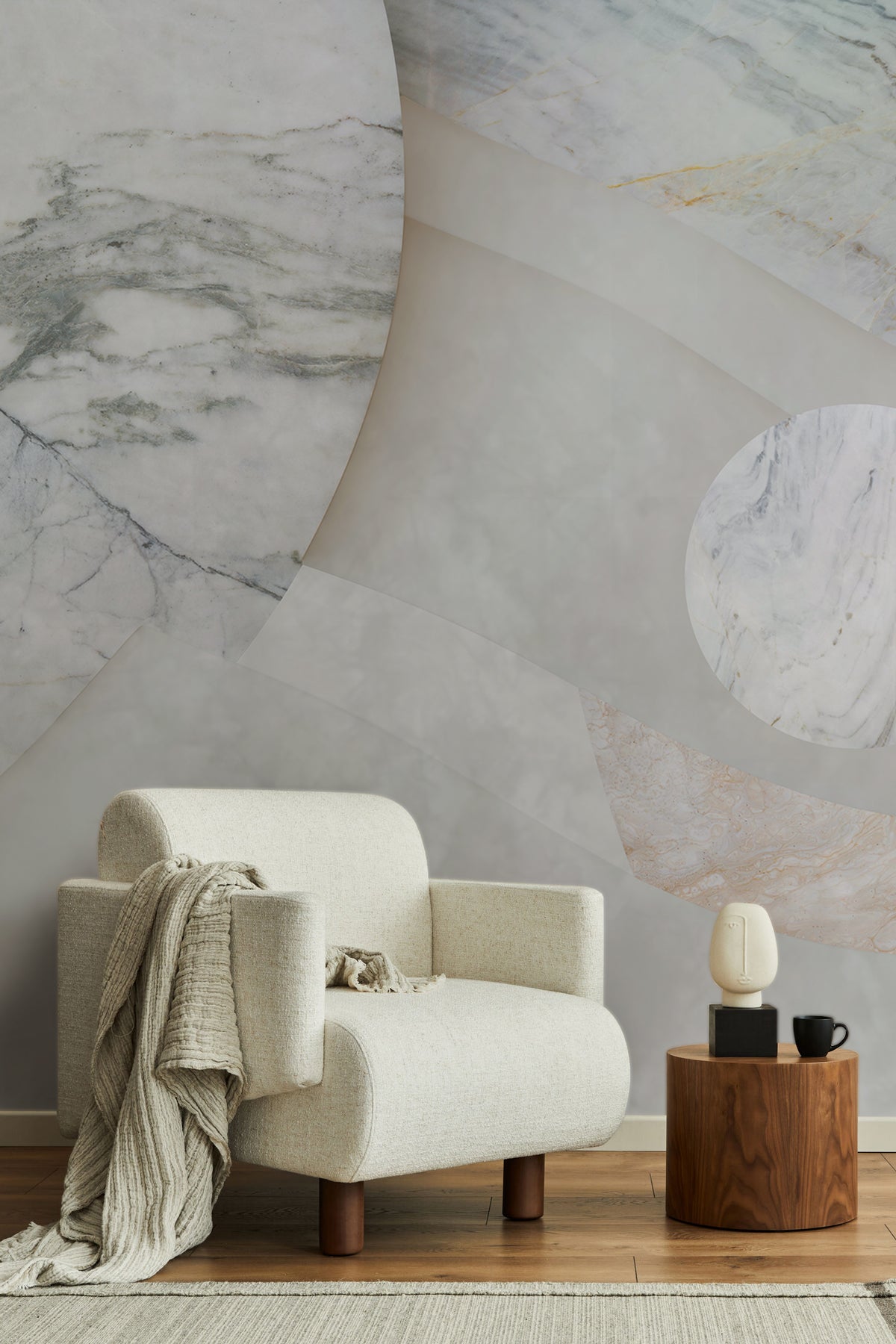Astra Veil / Marble wall mural behind a Beige armchair with a wooden side table.