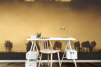 Blue wildebeest in dust at sunrise Wall Mural-Wall Mural-Eazywallz